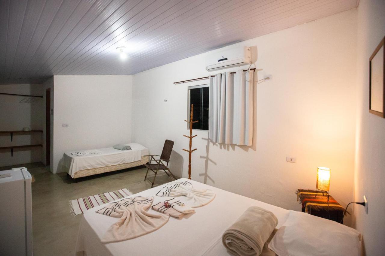 Quarto Triplo com Vista para a Piscina
