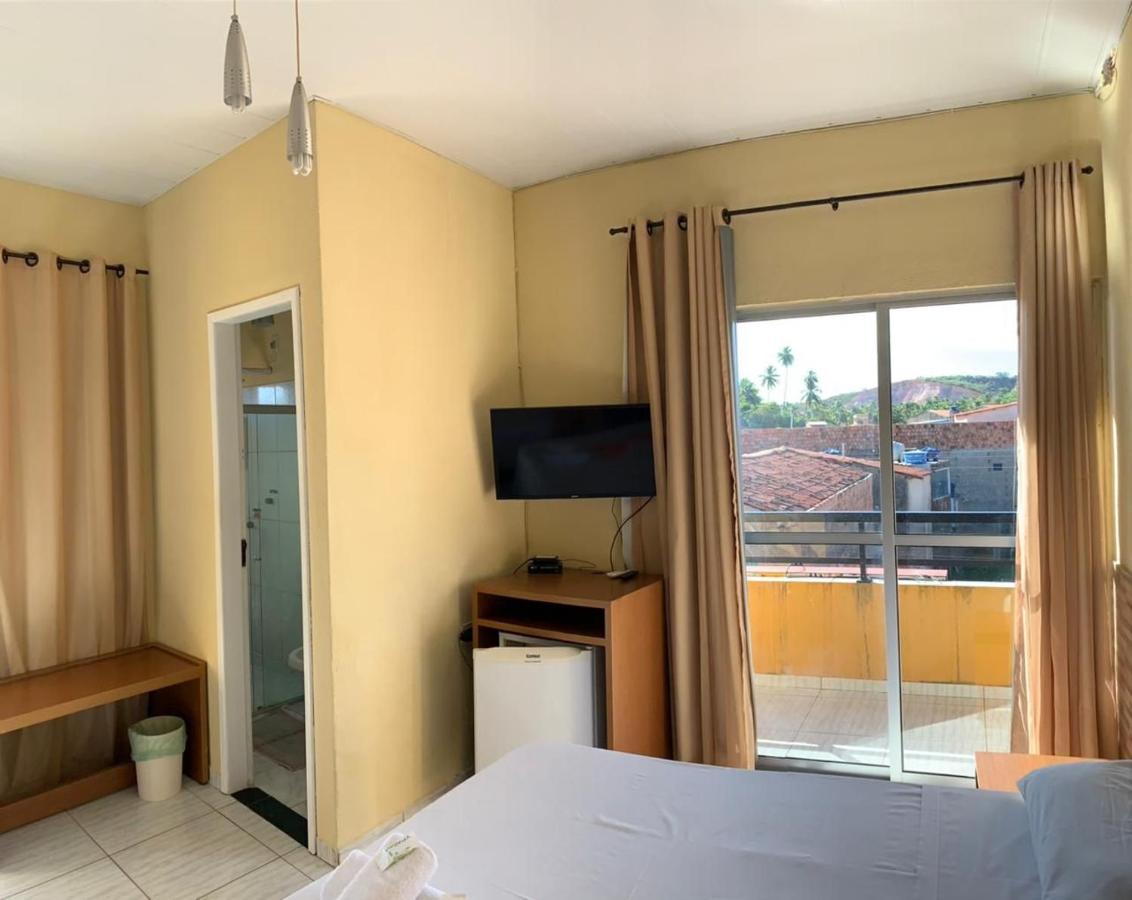 Quarto Triplo Deluxe com Varanda