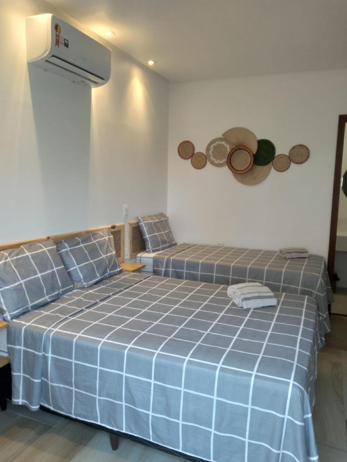 Quarto Triplo com Vista para a Piscina